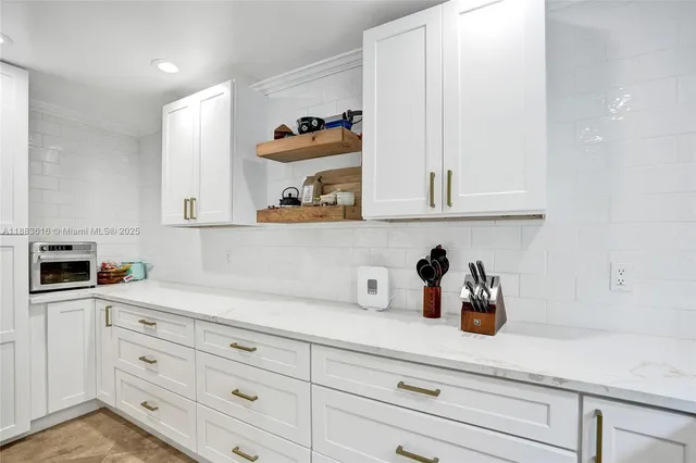 a bathroom with a sink a mirror and a shower