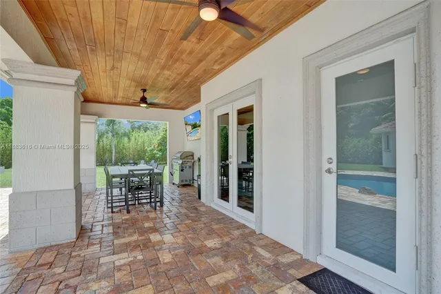 a view of a house with swimming pool and sitting area