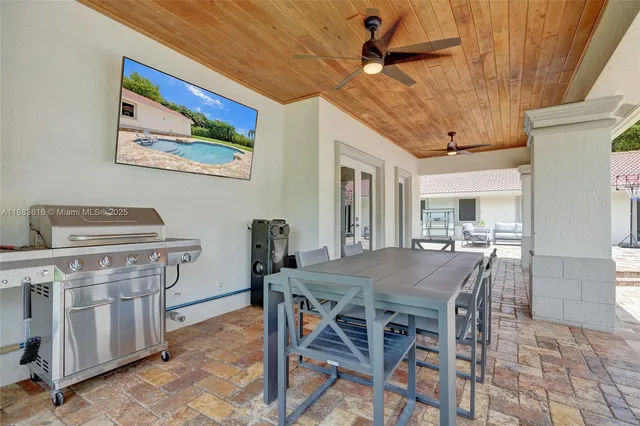 a view of swimming pool with lounge chair in the patio