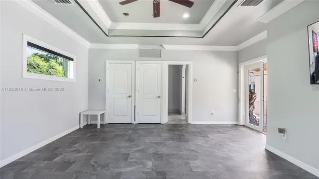 a view of a patio with table and chairs and potted plants