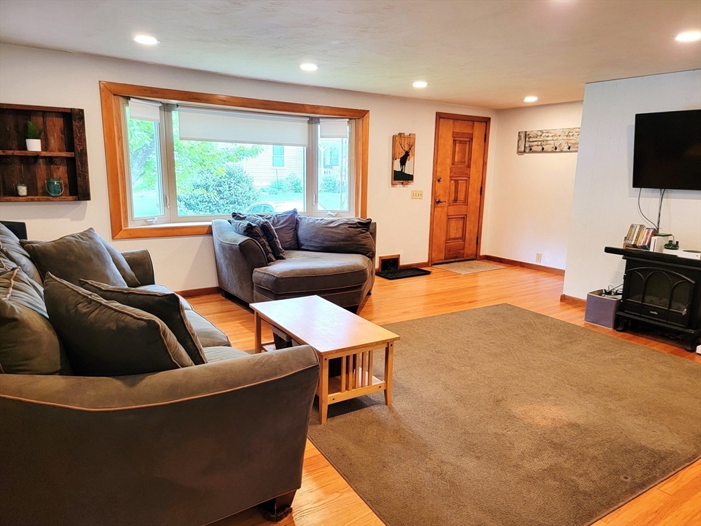 2022 Quaboag Street Three Rivers, MA 01080 - Photo 4 of 16 a living room with furniture and a flat screen tv