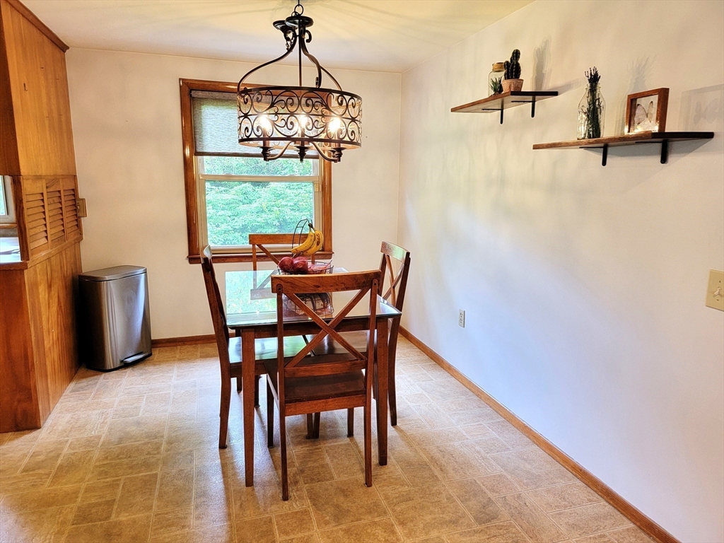 2022 Quaboag Street Three Rivers, MA 01080 - Photo 5 of 16 a dining room with furniture and window