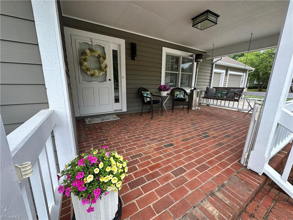 633 Huntington Drive High Point, NC 27262 - Photo 4 of 34 Dont miss the puppy gate on the porch.