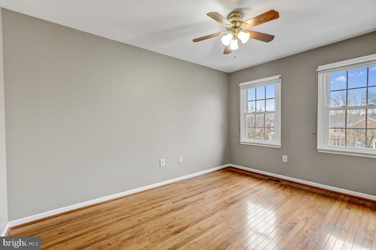 14216 Catamount Court Silver Spring, MD 20906 - Photo 12 of 30 wooden floor in an empty room with a window