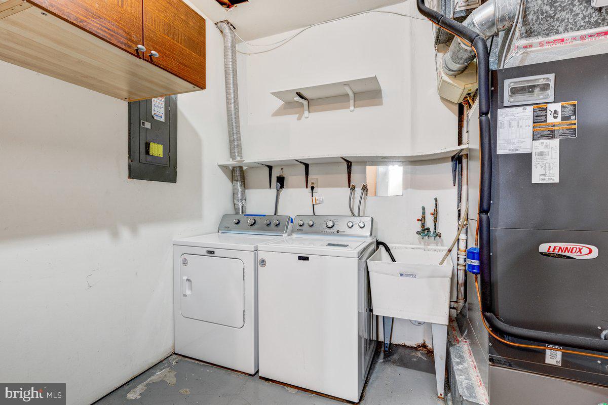 14216 Catamount Court Silver Spring, MD 20906 - Photo 14 of 30 a bathroom with a granite countertop sink a mirror and a vanity