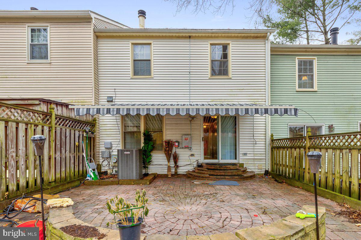 14216 Catamount Court Silver Spring, MD 20906 - Photo 17 of 30 a view of a house with a patio and a yard