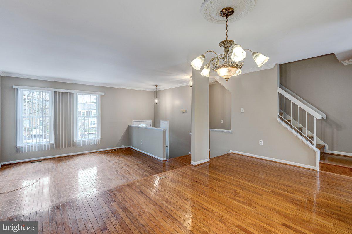 14216 Catamount Court Silver Spring, MD 20906 - Photo 19 of 30 a view of an empty room with wooden floor and a window