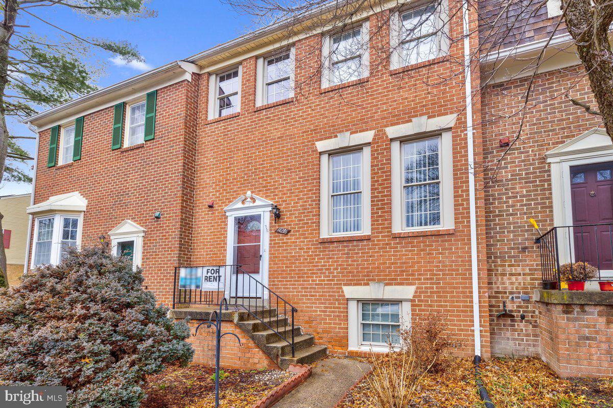 14216 Catamount Court Silver Spring, MD 20906 - Photo 21 of 30 a front view of a house with many windows