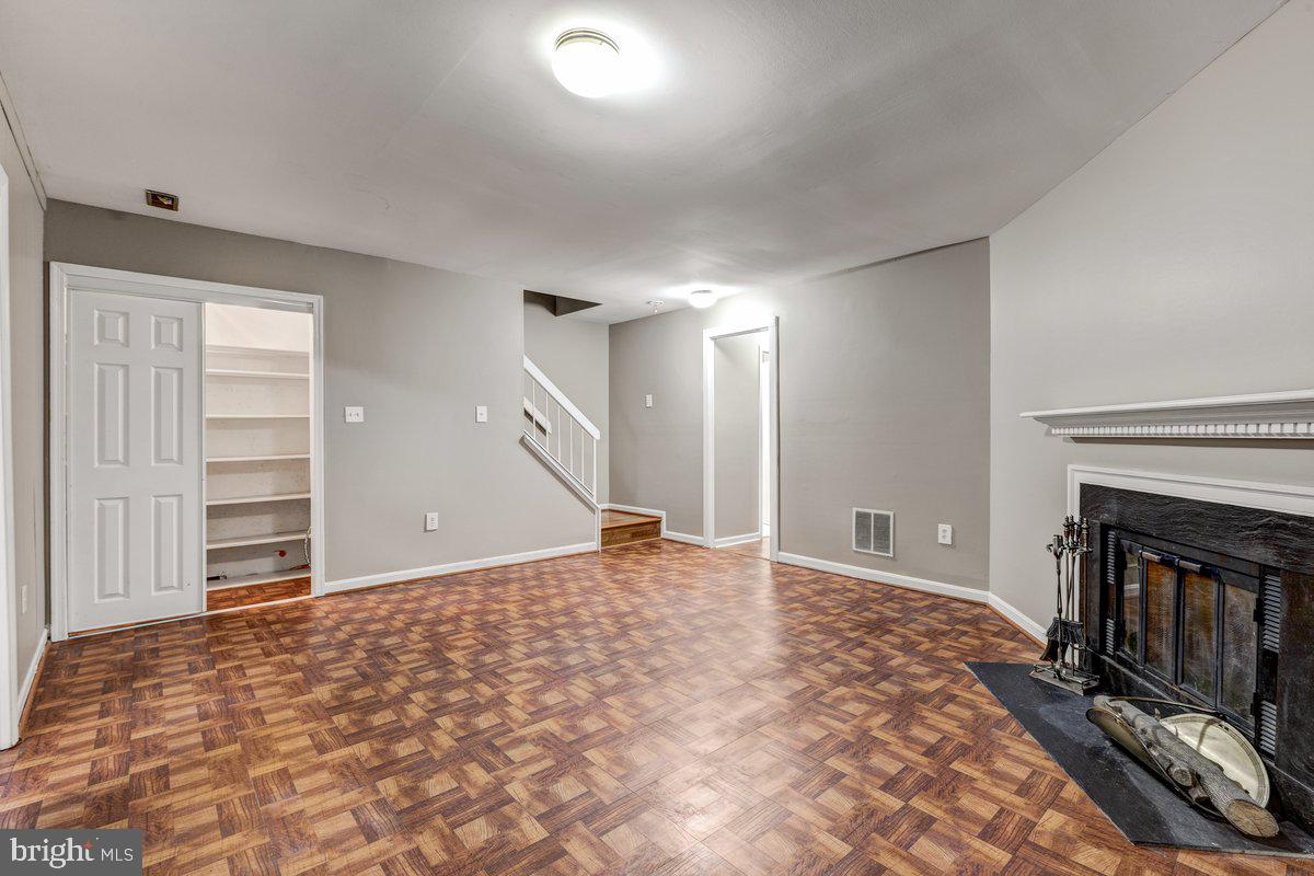 14216 Catamount Court Silver Spring, MD 20906 - Photo 28 of 30 a view of empty room with a fireplace and fan