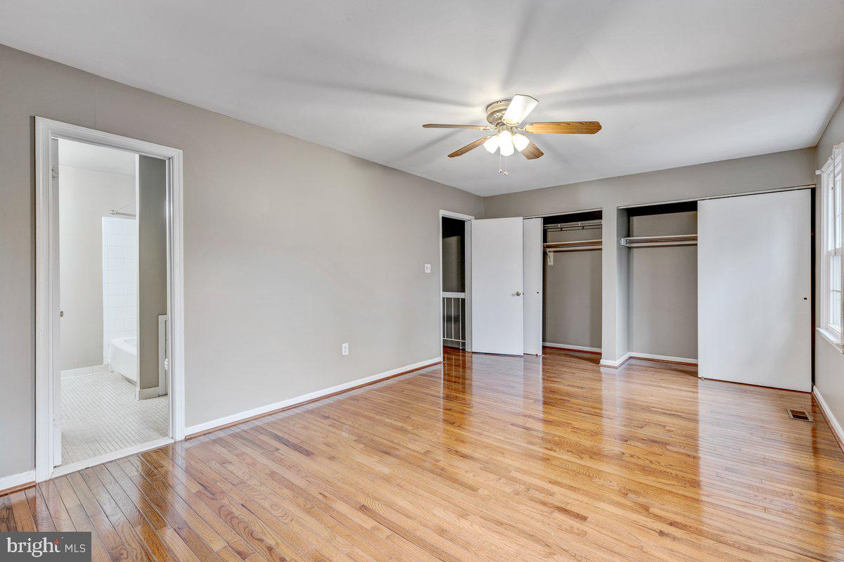 14216 Catamount Court Silver Spring, MD 20906 - Photo 7 of 30 a view of an empty room with window and wooden floor