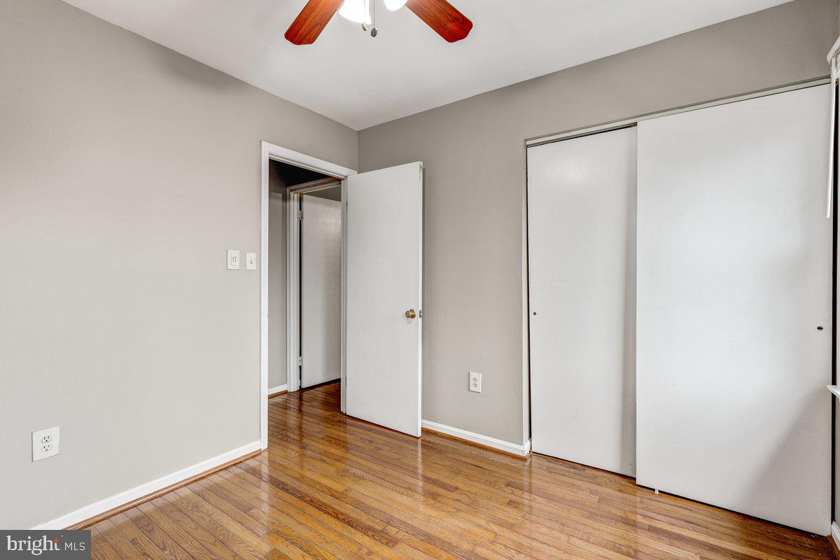14216 Catamount Court Silver Spring, MD 20906 - Photo 10 of 30 an empty room with wooden floor and closet