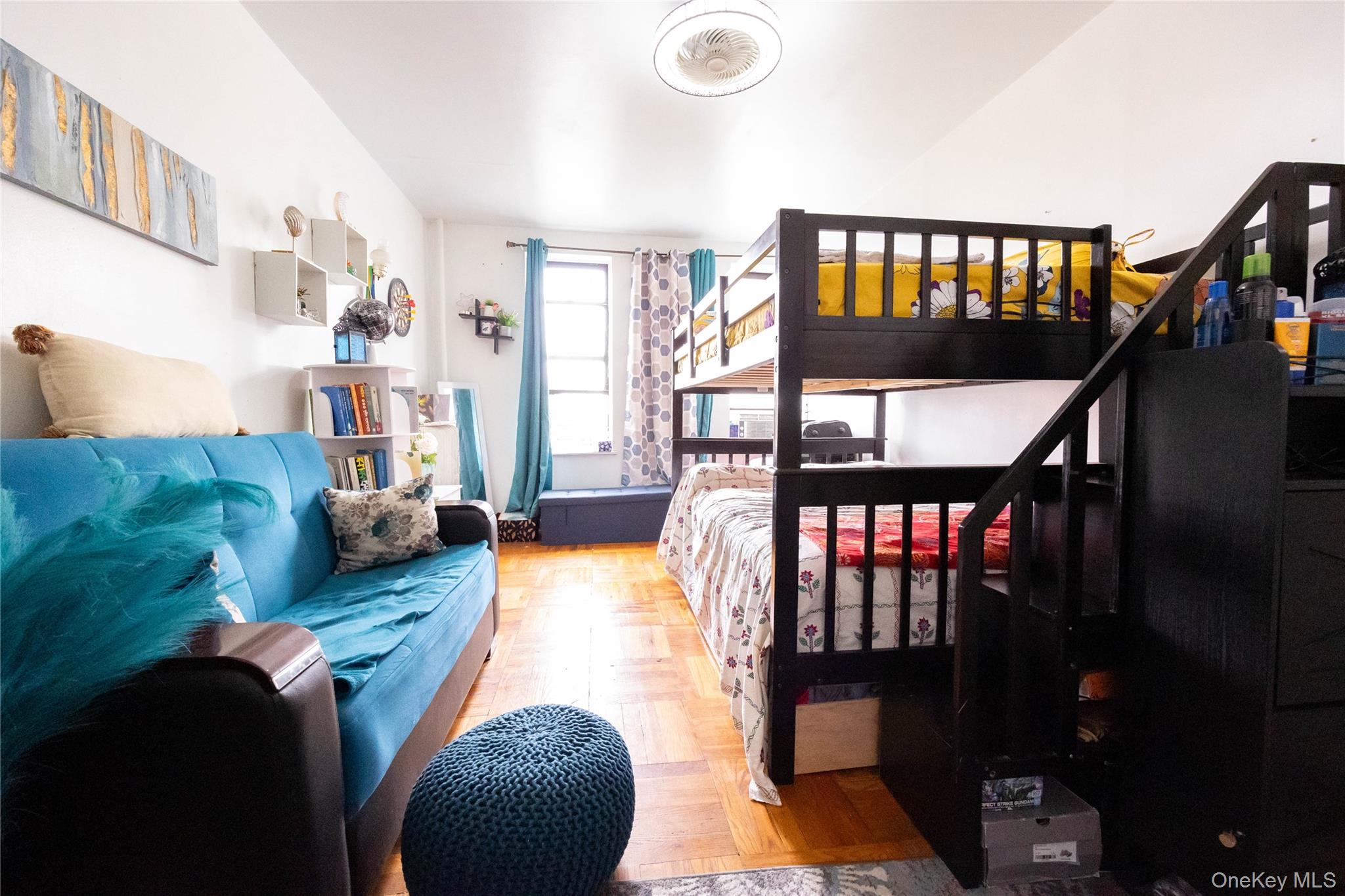 1506 Overing Street, Unit 6C Bronx, NY 10461 - Photo 10 of 16 a living room with furniture and a floor to ceiling window