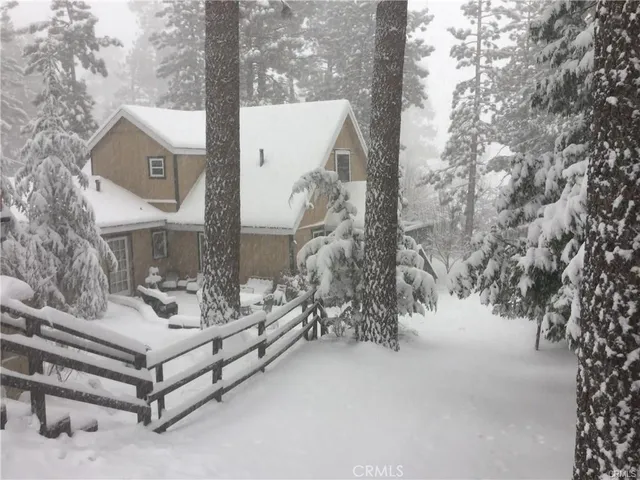 a view of a bench in the snow