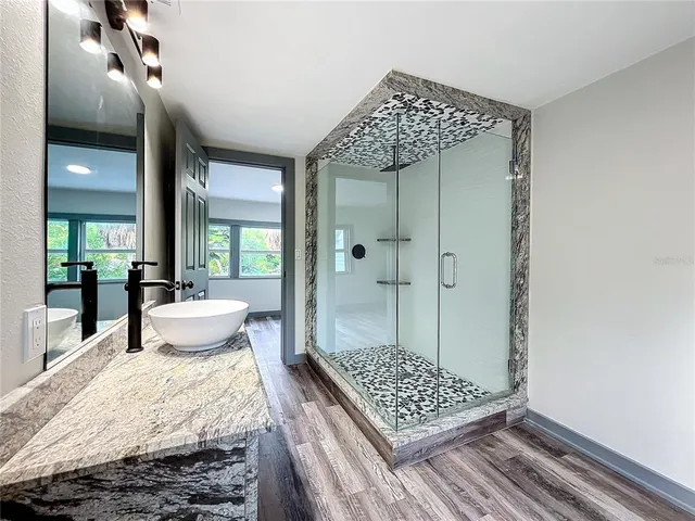 an aerial view of a houses with a lake view