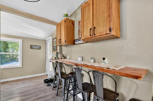 a view of a dining room with furniture and a window