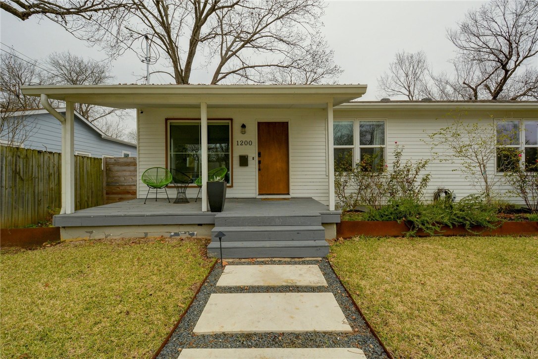 1200 Alguno Road Austin, TX 78757 - Photo 1 of 1 front view of a house with a yard