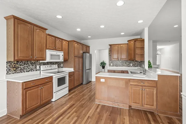 a view of kitchen and dining room with wooden floor
