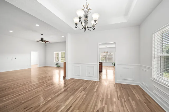 a bathroom with a sink mirror and toilet
