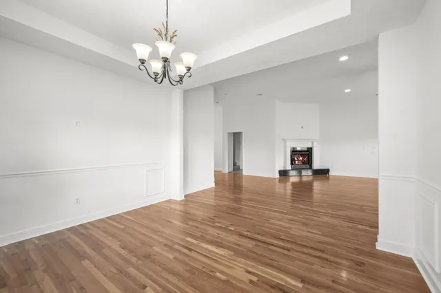 a view of hallway with wooden floor