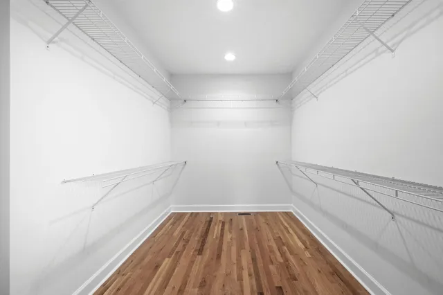 a view of an empty room with windows