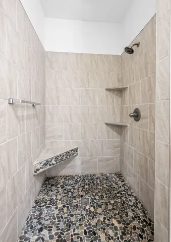 a view of a house with a big yard and large trees