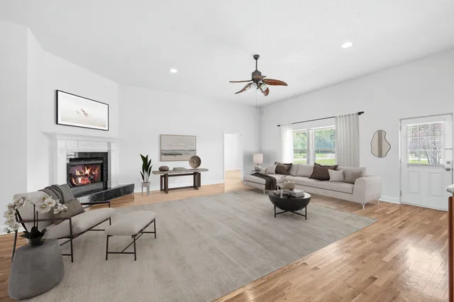 a large kitchen with stainless steel appliances granite countertop a stove a sink and a refrigerator