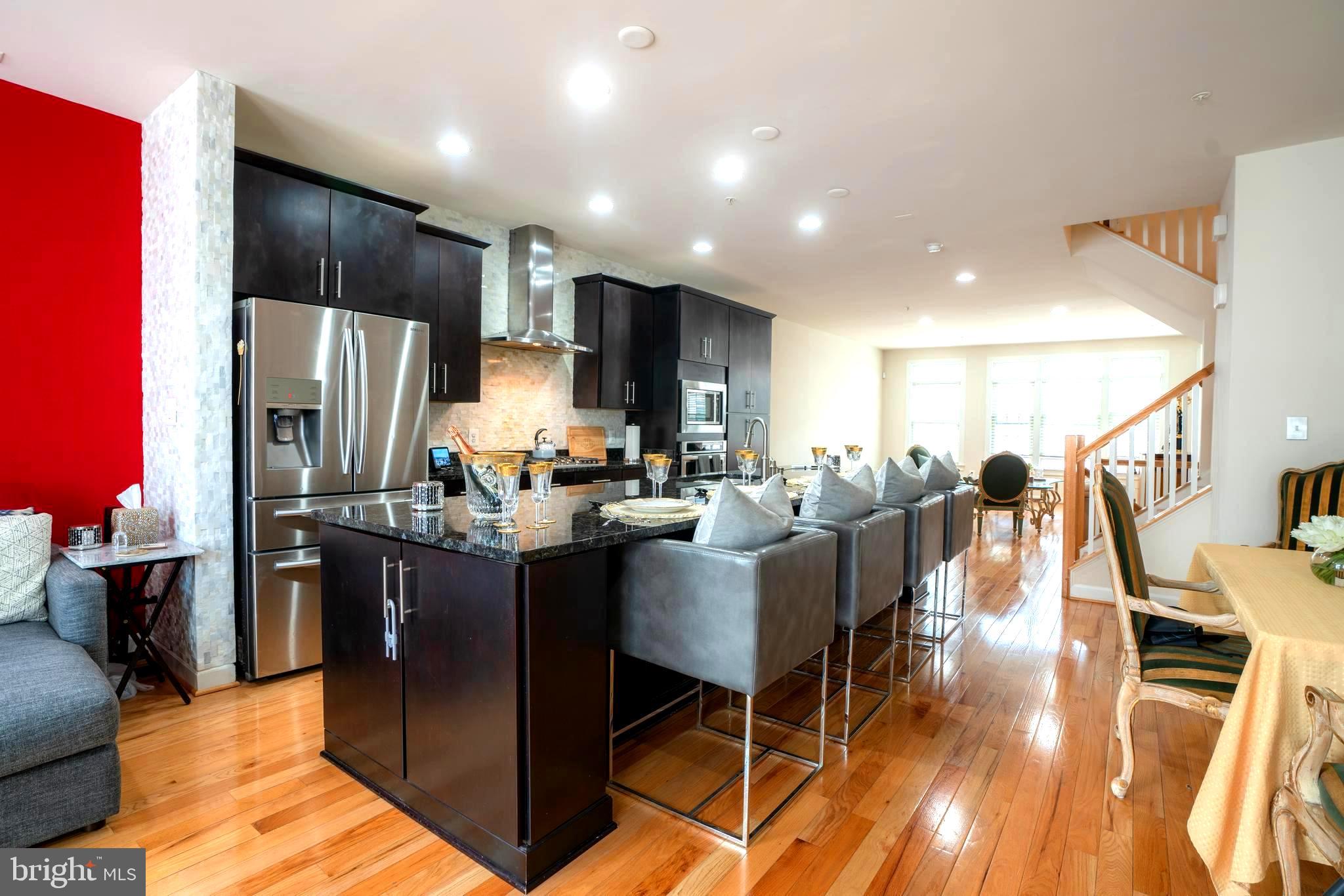 7447 Burnside Way Hanover, MD 21076 - Photo 2 of 19 Huge Granite Island comfortably seats Four