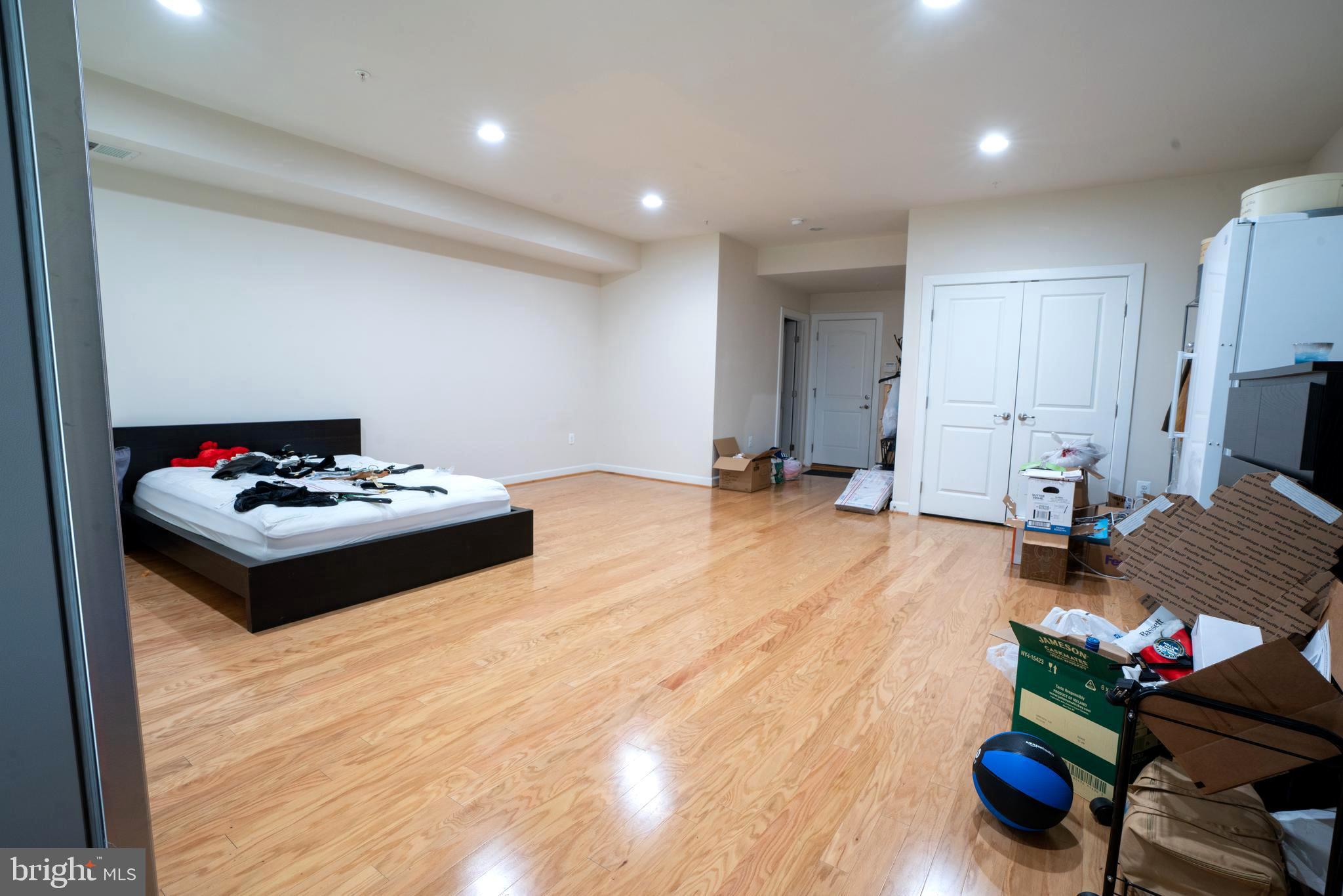 7447 Burnside Way Hanover, MD 21076 - Photo 10 of 19 Huge Family Room HW Floors Recessed Lighting