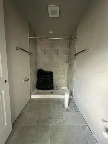 a bathroom with a bathtub and shower