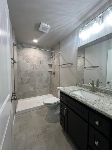 a view of storage and utility room with wooden floor