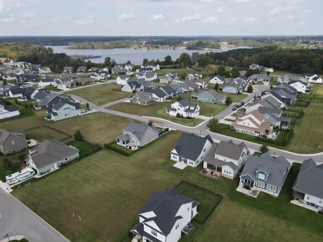 an aerial view of a house with a ocean view