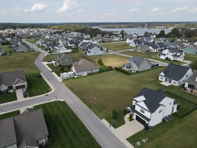 an aerial view of a house with a ocean view