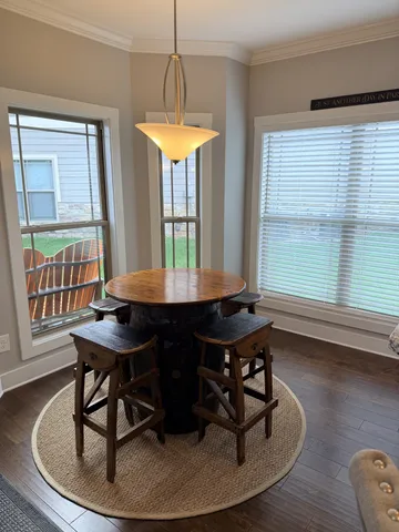a dining room with furniture and window