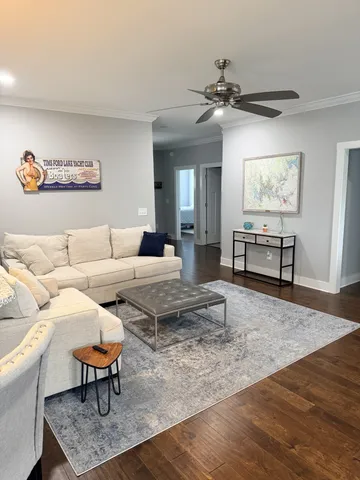 a living room with furniture and a rug