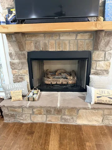 a fireplace with a clock on top of it