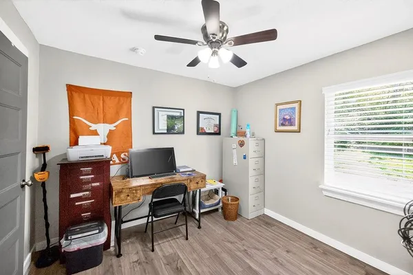 a workspace with furniture and a window
