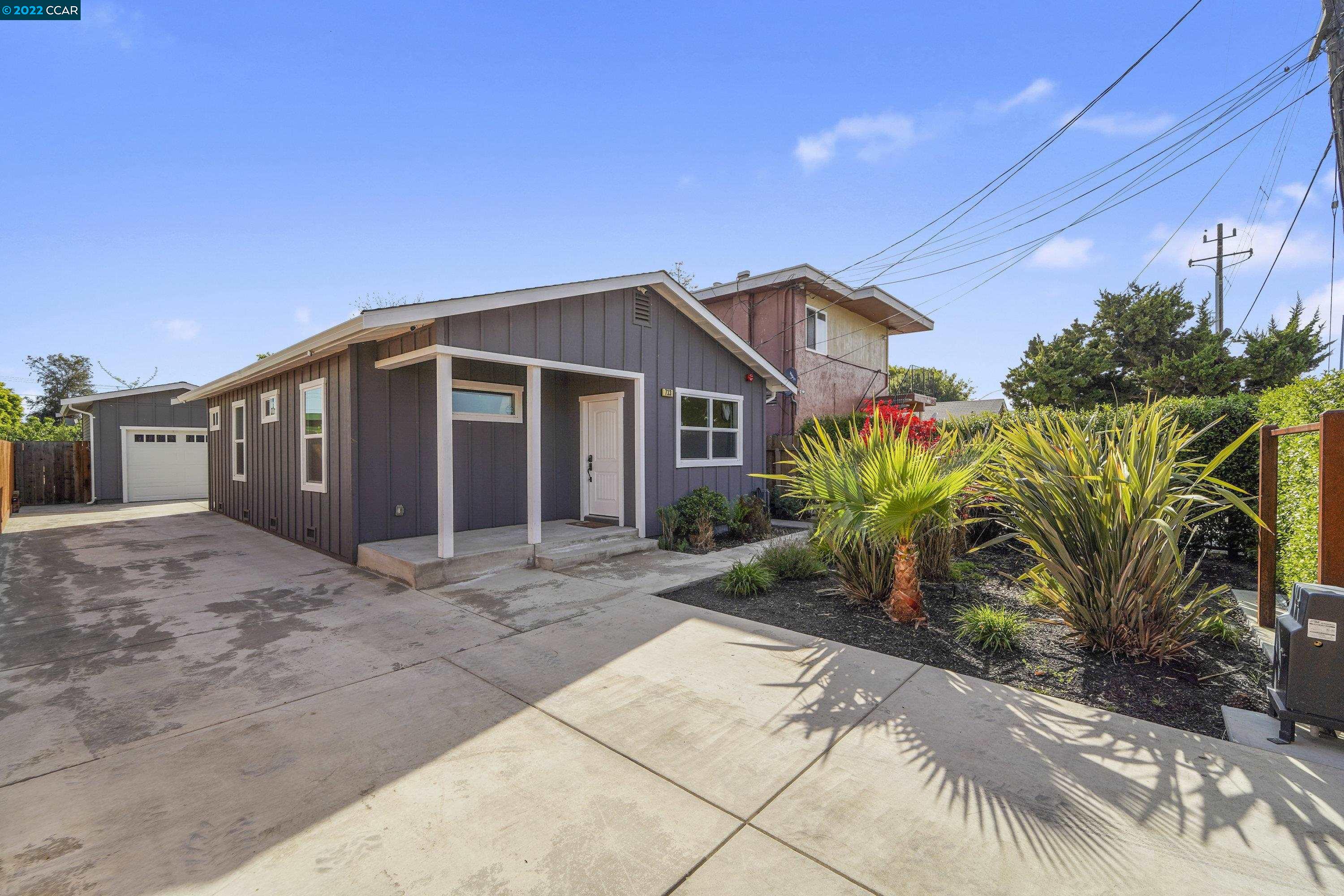 733 San Pablo Avenue Rodeo, CA 94572 - Photo 1 of 1 a front view of a house with garden