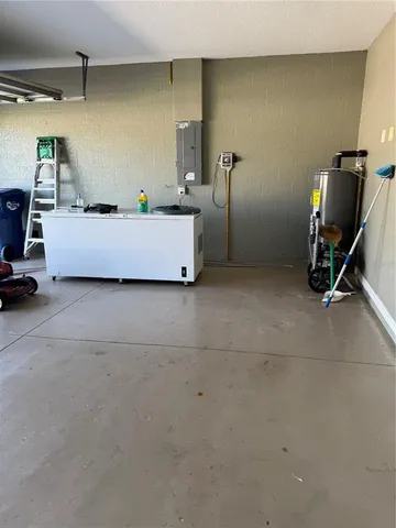 a living room with chairs and a window