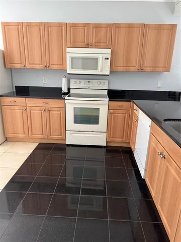 a view of room with a chair and a window