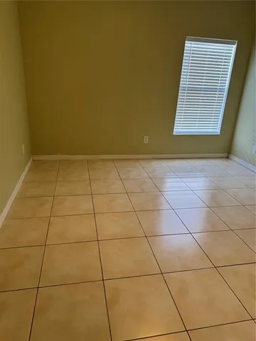 a bathroom with a toilet and a bath tub