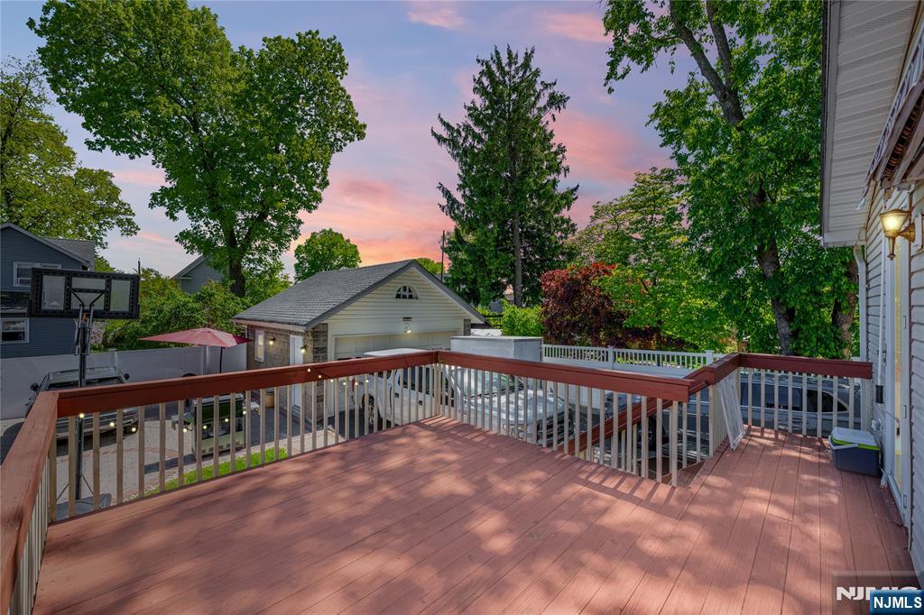690 Garden Street Maywood, NJ 07607 - Photo 41 of 49 a view of a wooden deck and a yard