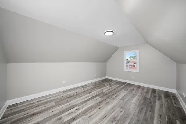 a view of room with window and hardwood floor