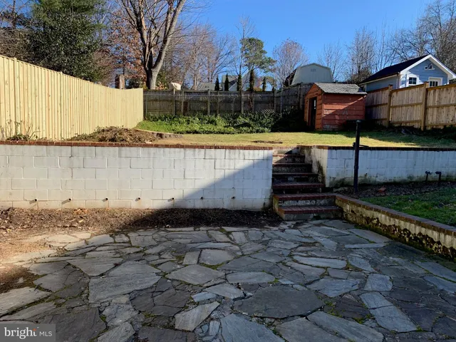 a view of a pathway with a yard