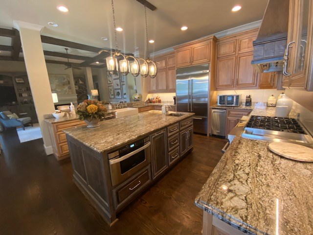 7233 Standing Boy Road Columbus, GA 31904 - Photo 15 of 67 a kitchen with stainless steel appliances granite countertop a stove and a refrigerator