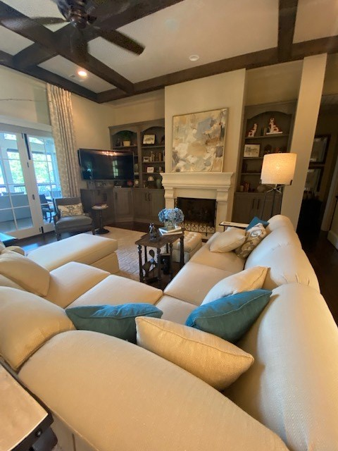 7233 Standing Boy Road Columbus, GA 31904 - Photo 10 of 67 a living room with furniture a fireplace and a flat screen tv