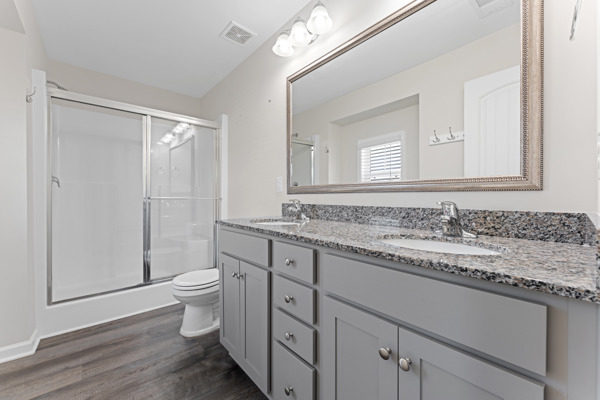249 Samuel Street Pendleton, SC 29670 - Photo 16 of 33 This modern bathroom features a dual vanity and sleek, functional design.