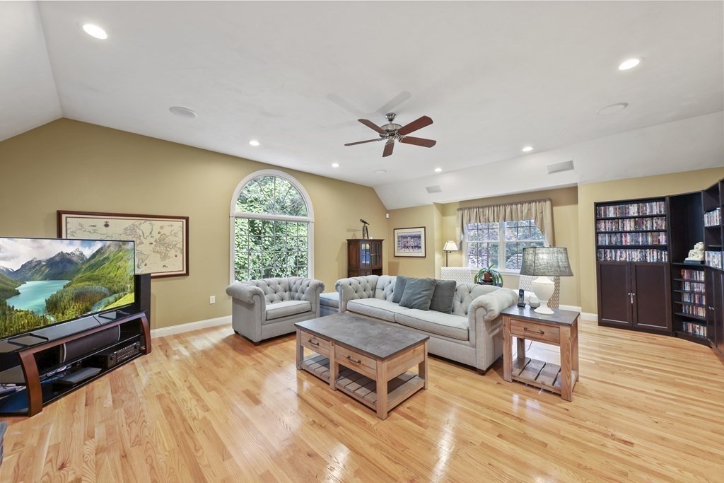 104 Forest Street Middleton, MA 01949 - Photo 14 of 41 a living room with furniture and a flat screen tv