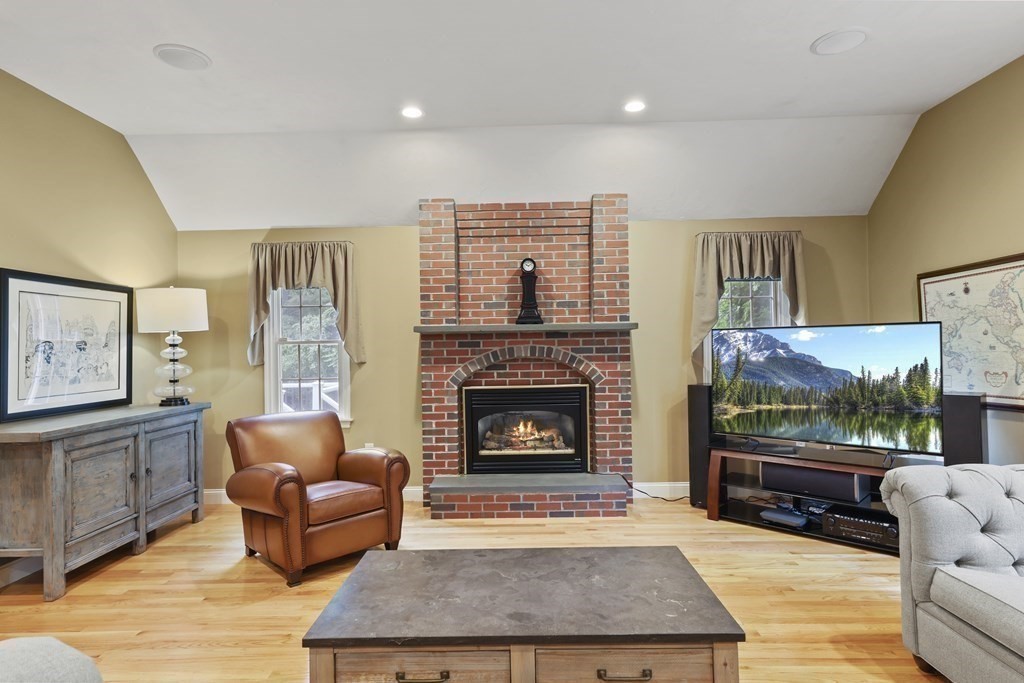 104 Forest Street Middleton, MA 01949 - Photo 17 of 41 a living room with furniture and a fireplace