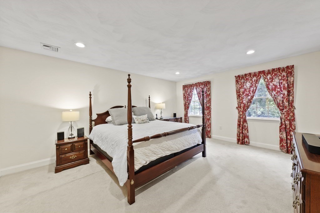 104 Forest Street Middleton, MA 01949 - Photo 19 of 41 a spacious bedroom with a bed and a large window