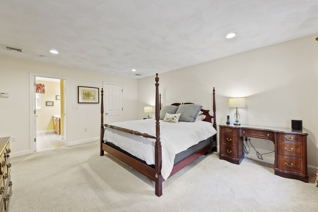 104 Forest Street Middleton, MA 01949 - Photo 21 of 41 a bed room with a bed and a chair